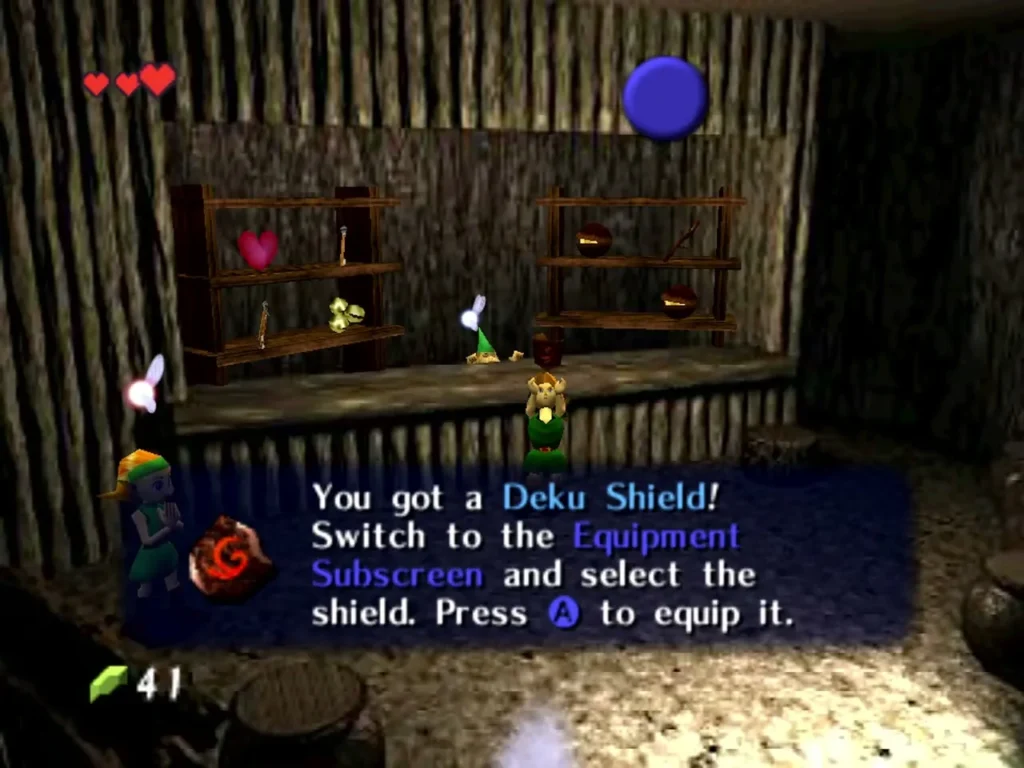Deku Shield message in the Kokiri Shop telling Link to equip it Deku Shield message in the Kokiri Shop telling Link to equip it