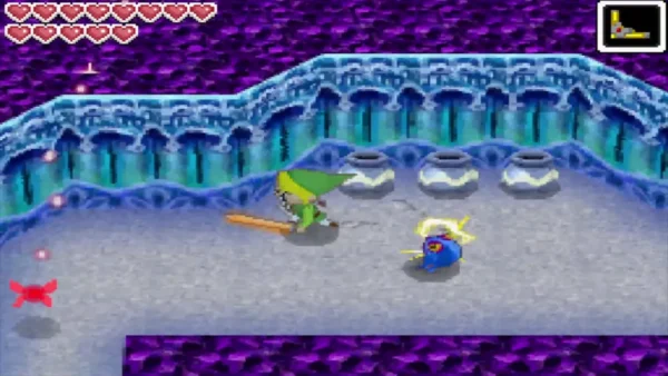 Link slashing a Blue ChuChu crackling with electricity in the Temple of Ice Link slashing a Blue ChuChu crackling with electricity in the Temple of Ice