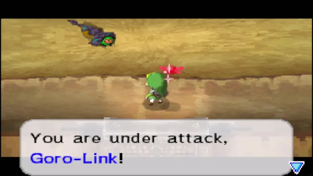 An Eye Slug creeping toward Link as a warning says he is under attack An Eye Slug creeping toward Link as a warning says he is under attack