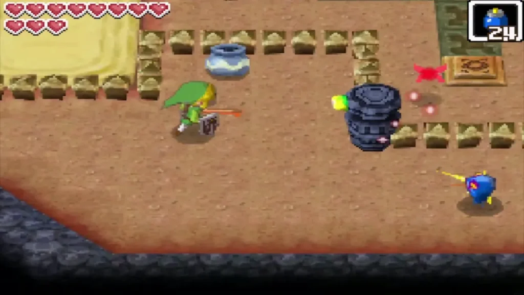 A Beamos statue with a glowing green eye as Link walks past in the Goron Temple A Beamos statue with a glowing green eye as Link walks past in the Goron Temple