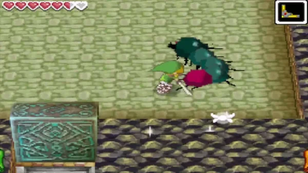 Link attacking the red tail of a Moldorm Link attacking the red tail of a Moldorm