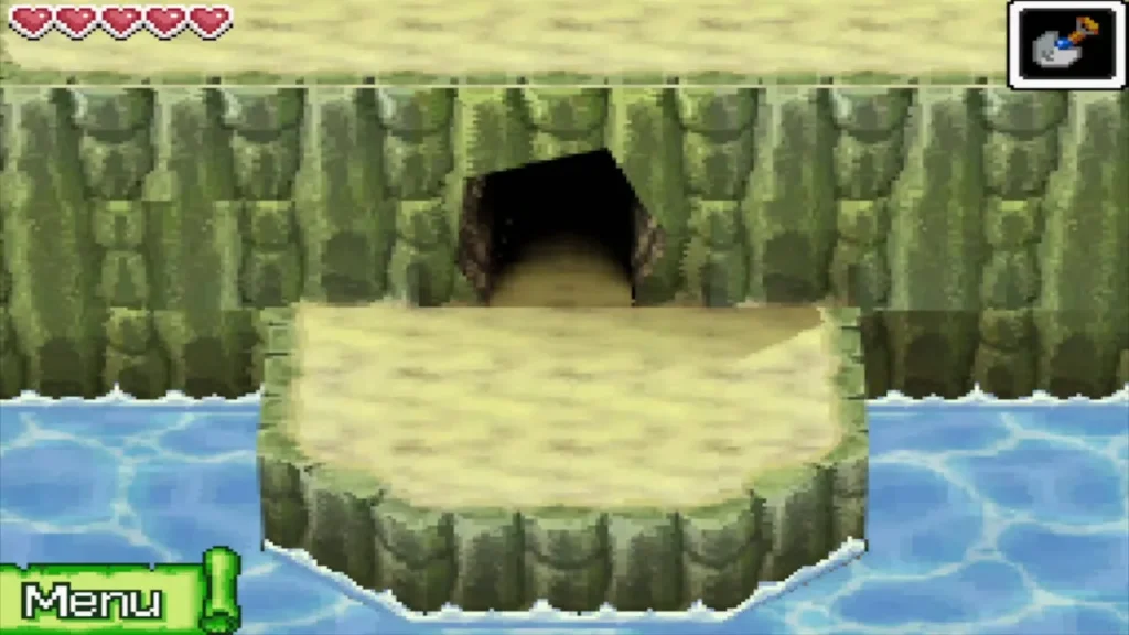 A cave mouth in the cliff above a sandy ledge on Uncharted Island A cave mouth in the cliff above a sandy ledge on Uncharted Island