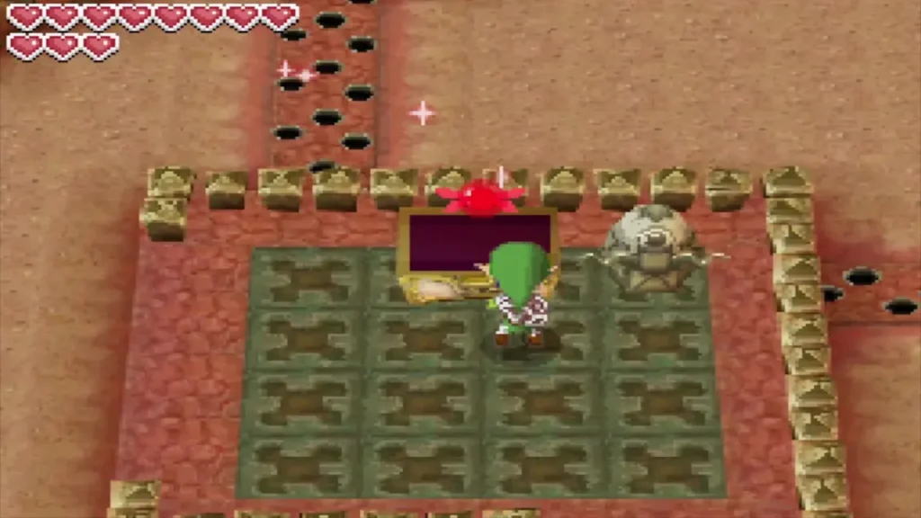 Link at the opened big chest in a Goron Temple room beside a stone statue Link at the opened big chest in a Goron Temple room beside a stone statue
