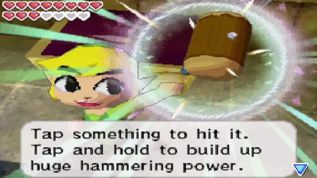 Link holds the hammer with the message about tapping and holding to build power Link holds the hammer with the message about tapping and holding to build power