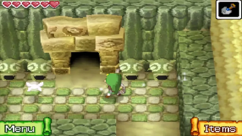 Link walking up to the stone doorway of the Temple of Wind on its sand island