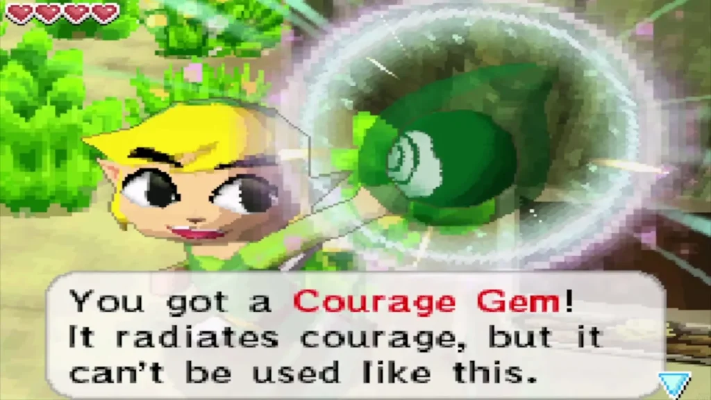 Link holding up a Courage Gem with its message box Link holding up a Courage Gem with its message box