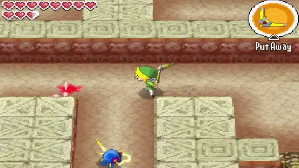 Link walks a corridor between cracked stone blocks in the Goron maze Link walks a corridor between cracked stone blocks in the Goron maze