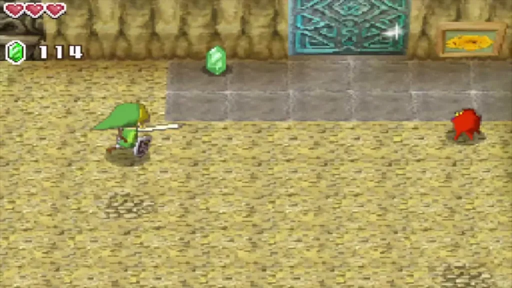 Link fighting a red monster in the basement near the teal door Link fighting a red monster in the basement near the teal door