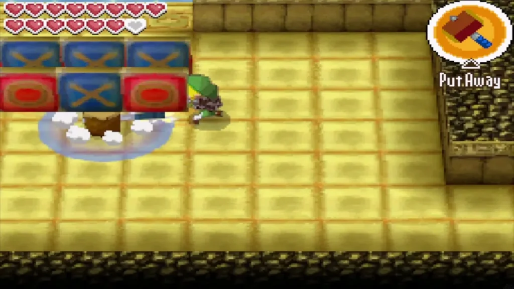 Link smashing a tile in a grid of X and O tiles with the Hammer Link smashing a tile in a grid of X and O tiles with the Hammer
