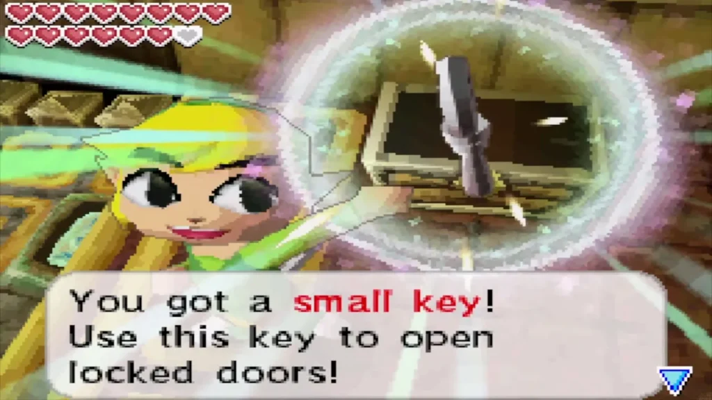 Link holding up the small key with the item message Link holding up the small key with the item message