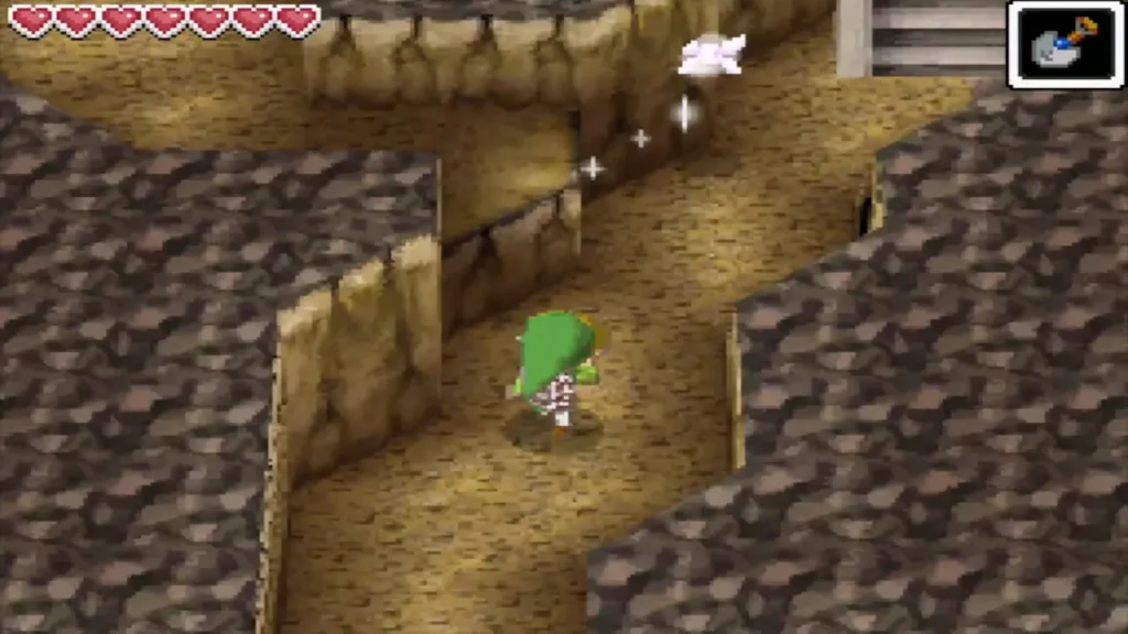 Link heading north along the winding cave toward the stairs Link heading north along the winding cave toward the stairs