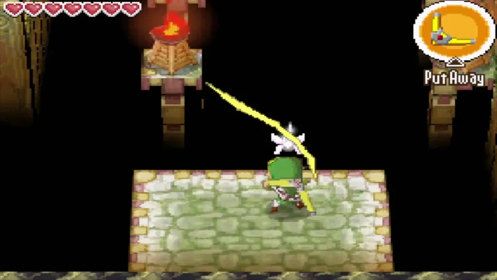 Link aiming the Boomerang at an unlit torch in the B1 torch room Link aiming the Boomerang at an unlit torch in the B1 torch room