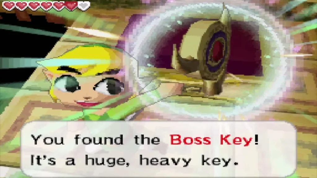 Link holding up the Boss Key with its message box Link holding up the Boss Key with its message box