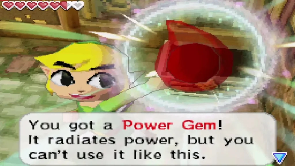 Link holding up a Power Gem with its message box Link holding up a Power Gem with its message box