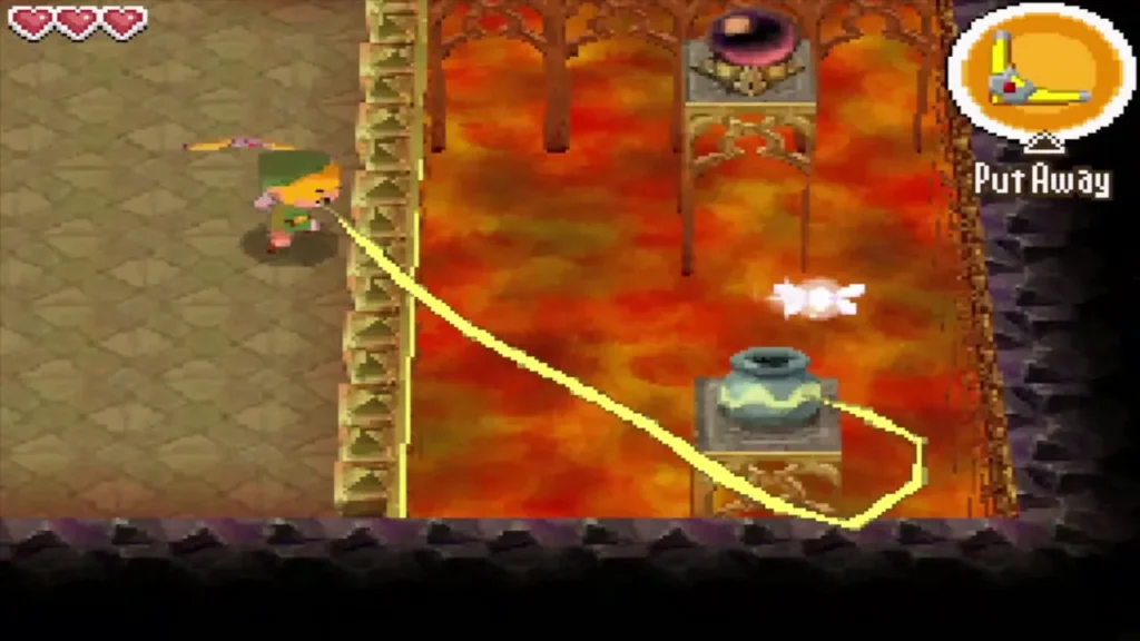 A yellow boomerang path curving over lava toward a pot A yellow boomerang path curving over lava toward a pot
