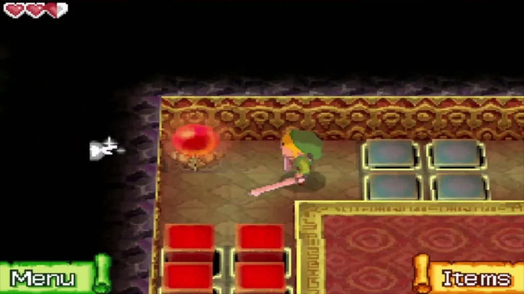 Link about to strike the red switch next to the red and blue blocks Link about to strike the red switch next to the red and blue blocks