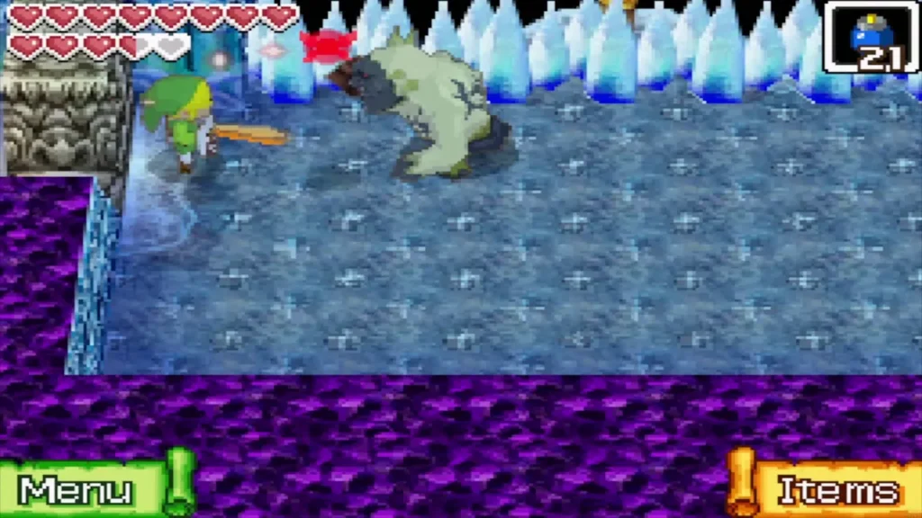 Link fighting a large grey beast on the ice floor beneath a wall of ice spikes Link fighting a large grey beast on the ice floor beneath a wall of ice spikes