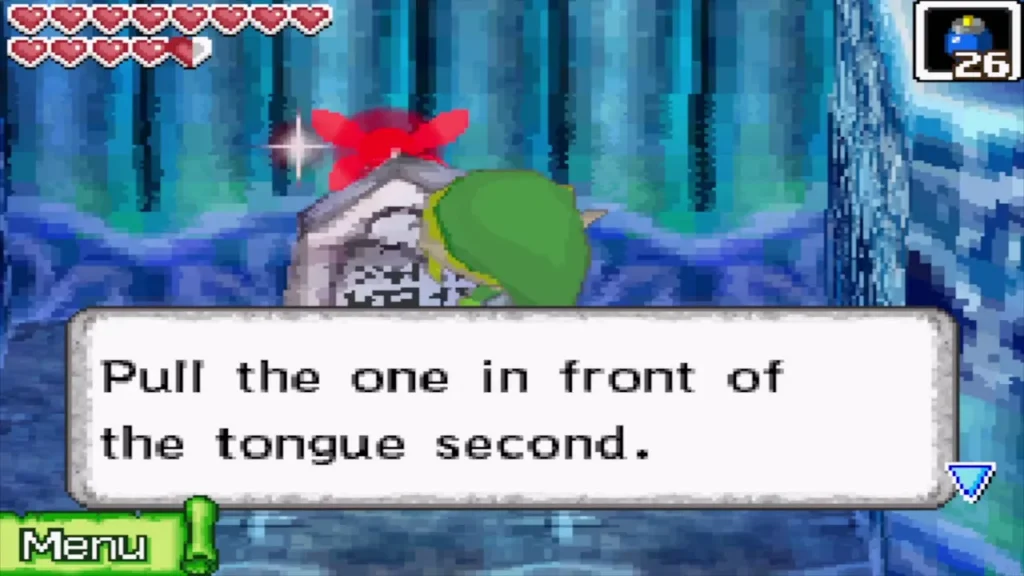 Link reading a stone tablet that hints to pull the one in front of the tongue second Link reading a stone tablet that hints to pull the one in front of the tongue second