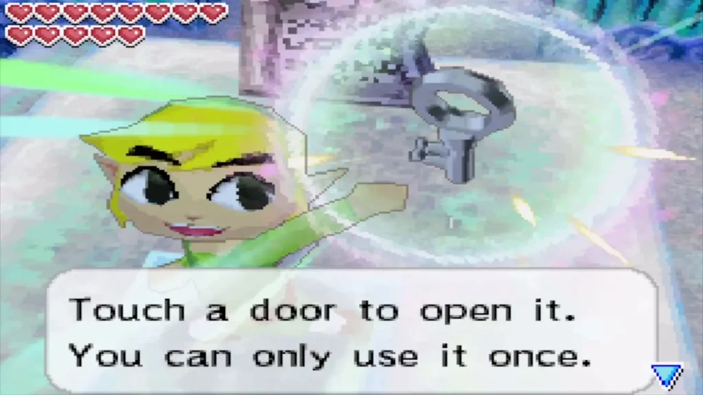 Link holding up a small key with the full message box about using it once Link holding up a small key with the full message box about using it once