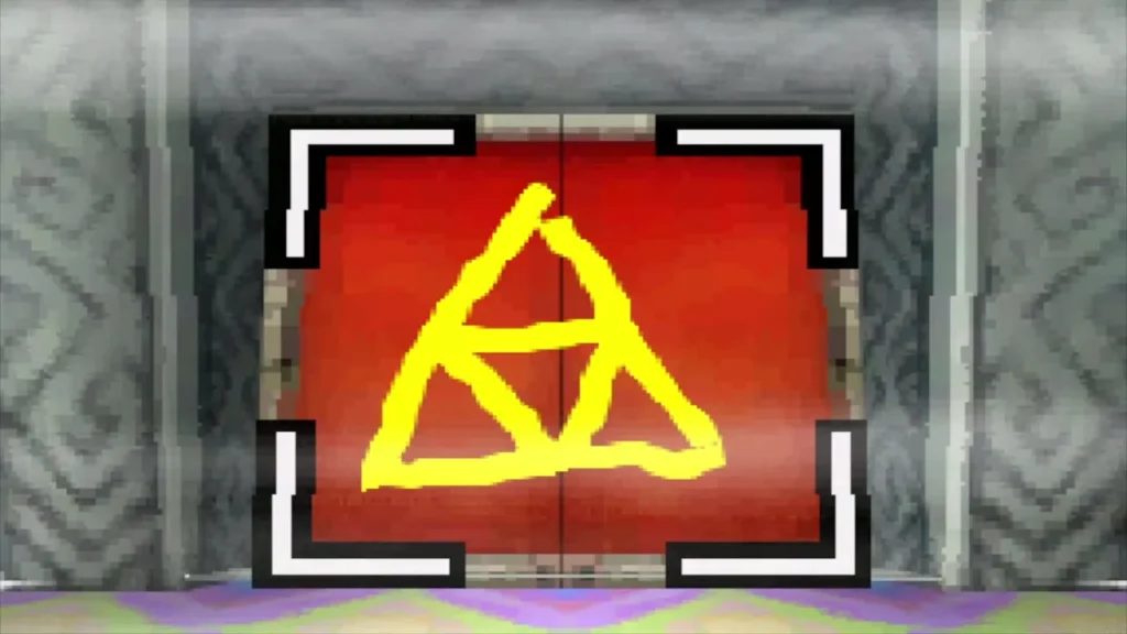The Triforce drawn in yellow on the red door The Triforce drawn in yellow on the red door