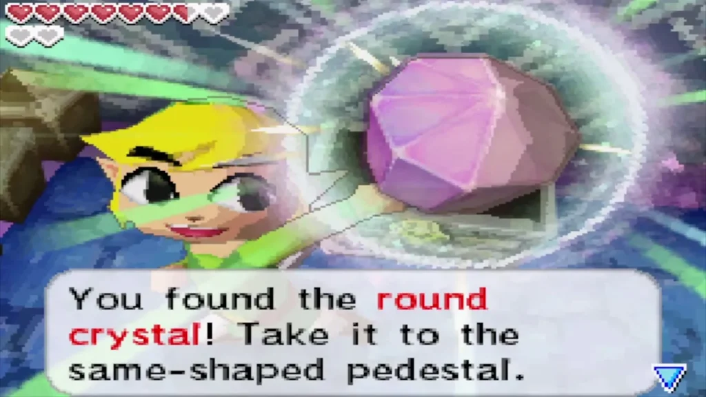 Link holding up the round crystal with its message from the chest Link holding up the round crystal with its message from the chest