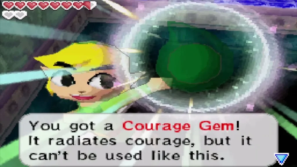 Link holding up the Courage Gem with its You got a Courage Gem message Link holding up the Courage Gem with its You got a Courage Gem message