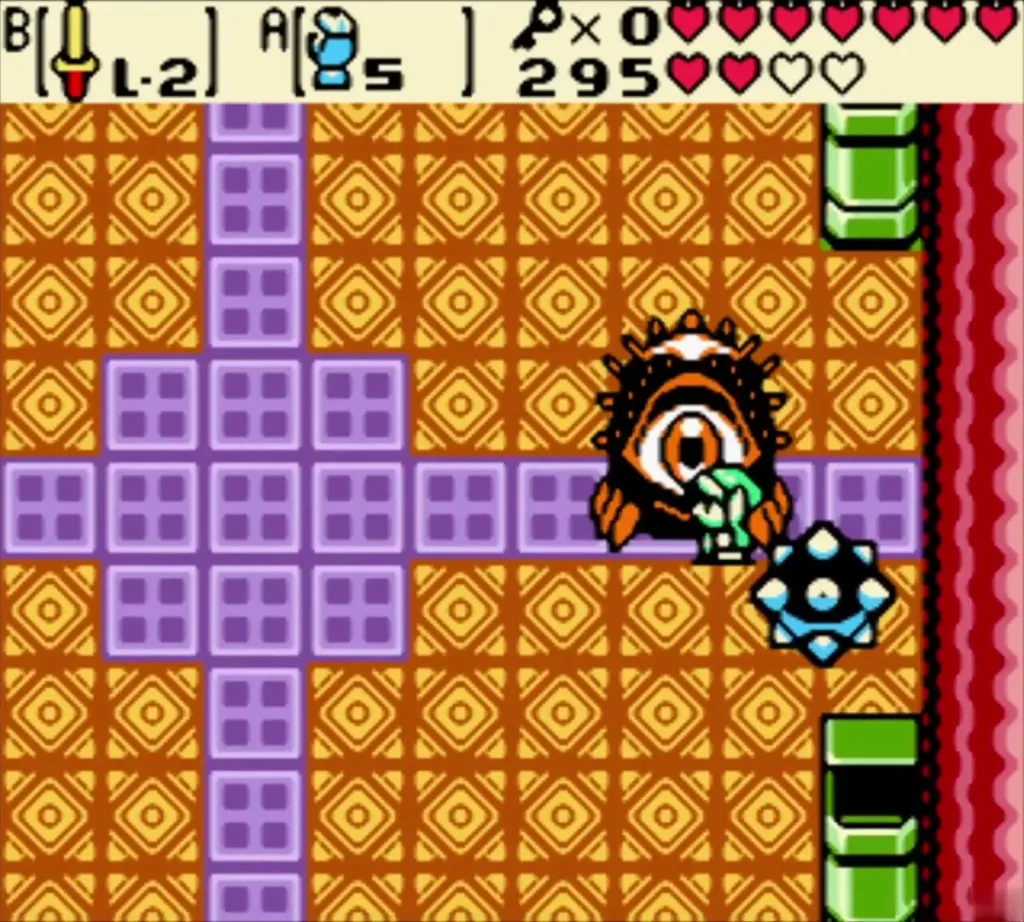 Link pressed against Digdogger's giant eye with the spiked ball beside it in Unicorn's Cave Link pressed against Digdogger's giant eye with the spiked ball beside it in Unicorn's Cave
