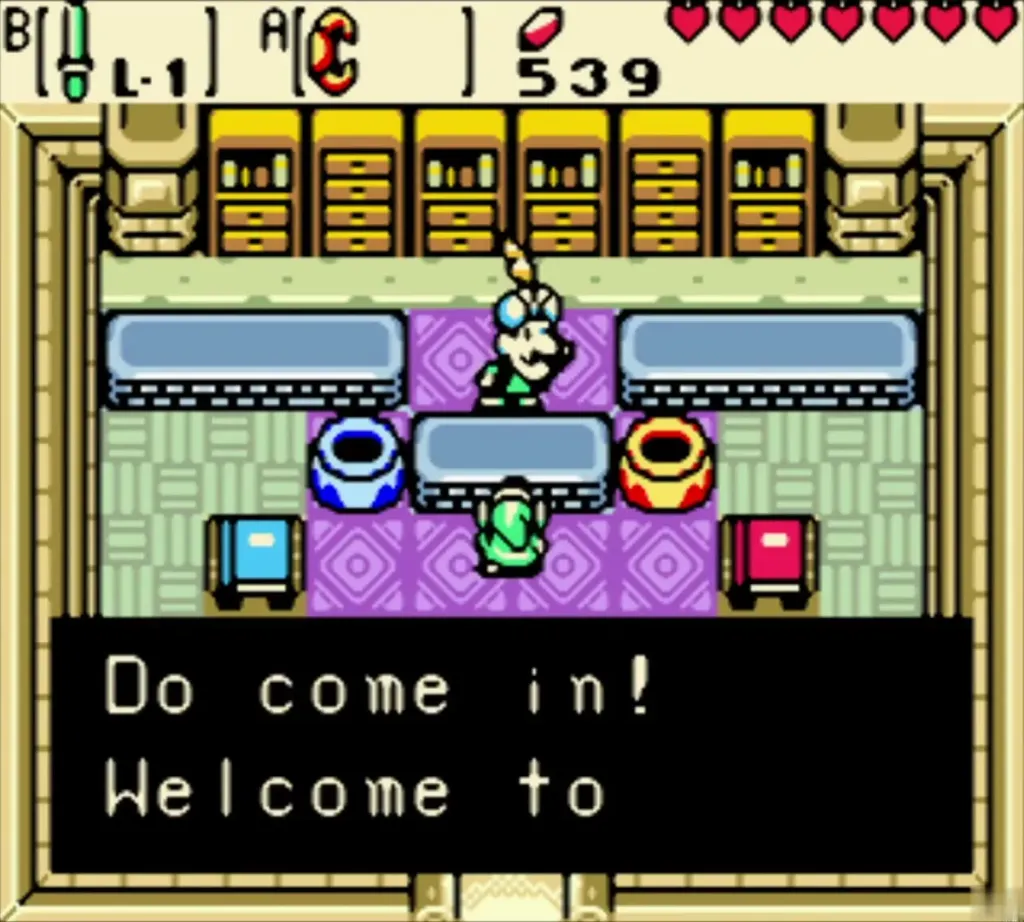 Vasu standing at his Jewelers counter saying Do come in! Welcome to