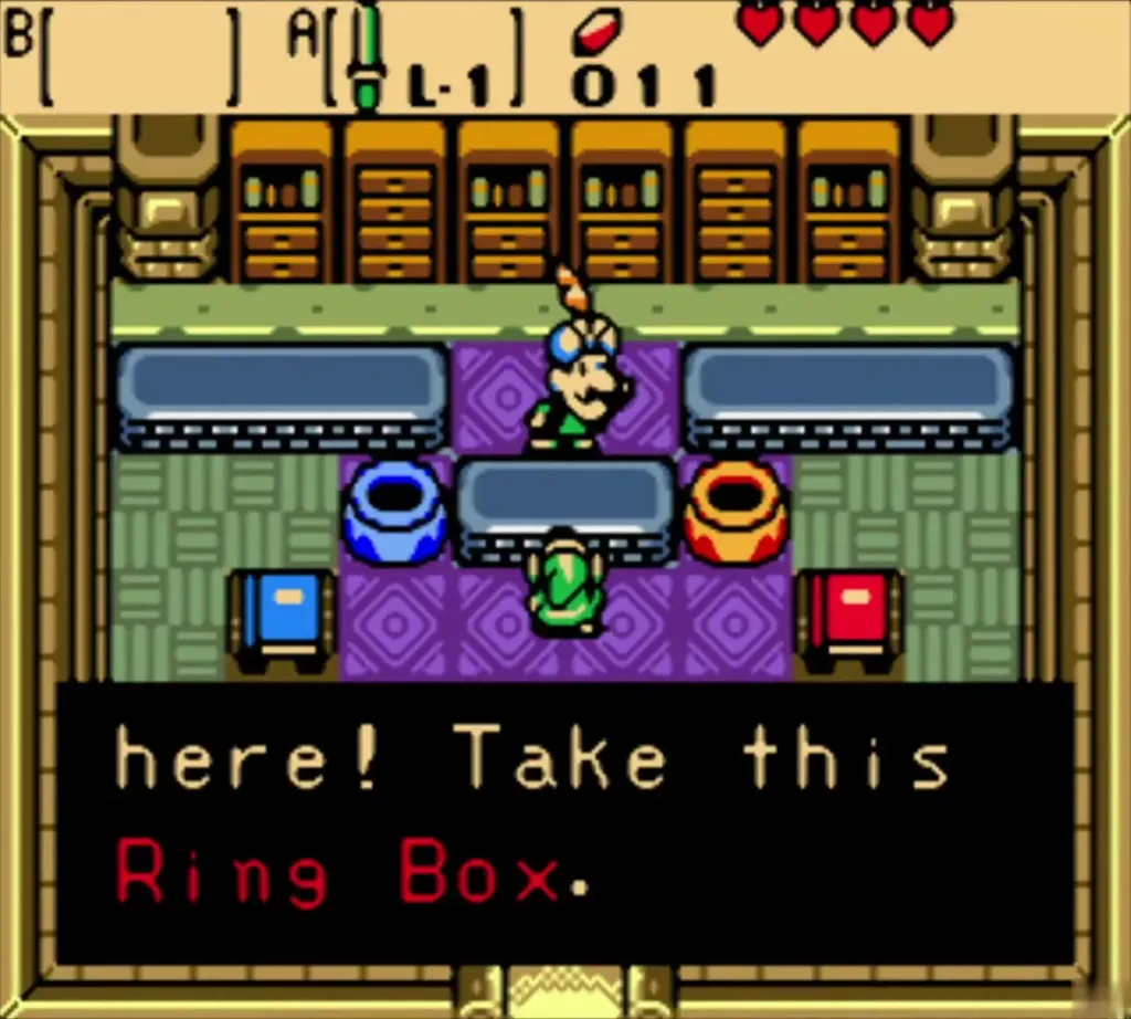 Vasu at his counter telling Link Take this Ring Box