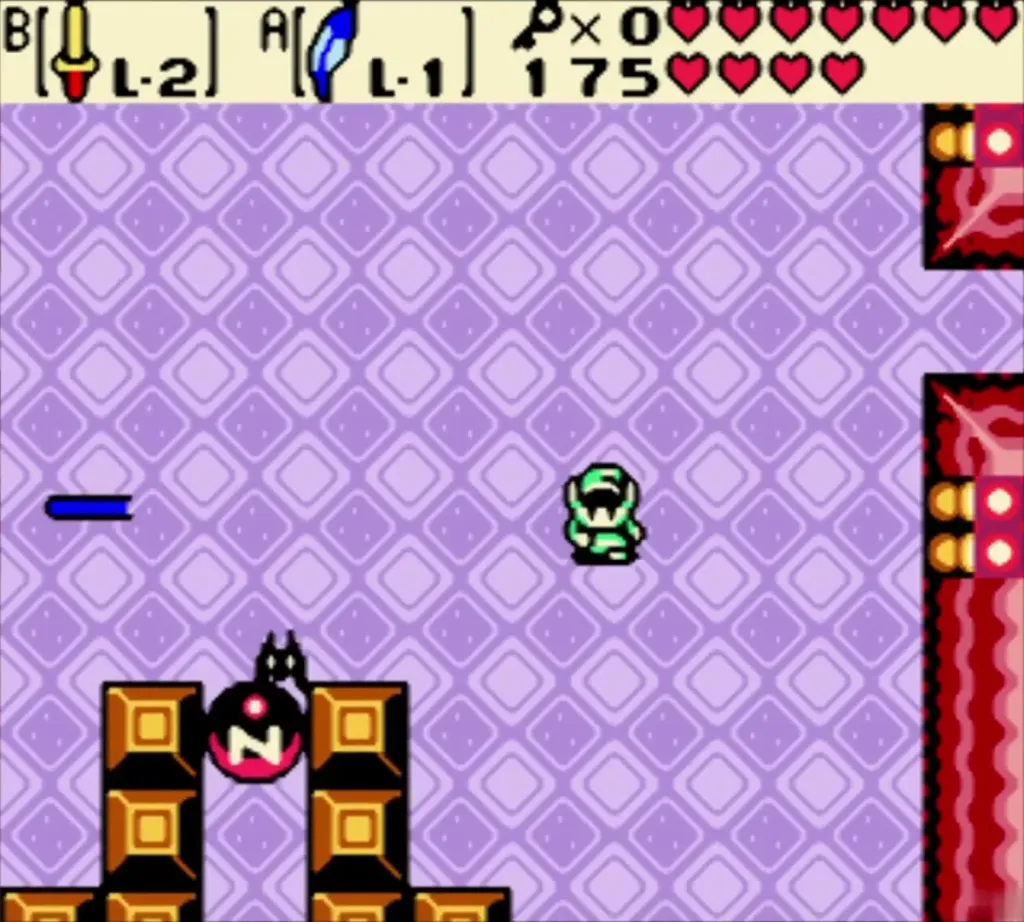 Link facing a red-faced enemy in a purple hall of the fifth dungeon Link facing a red-faced enemy in a purple hall of the fifth dungeon