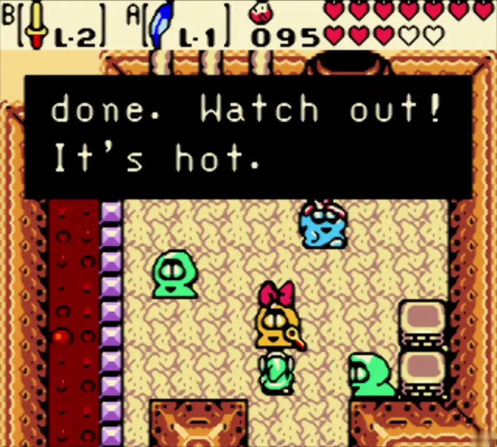 Subrosian smithy at the forge with the message reading "Your Hard Ore is done. Watch out! It's hot." Subrosian smithy at the forge with the message reading "Your Hard Ore is done. Watch out! It's hot."