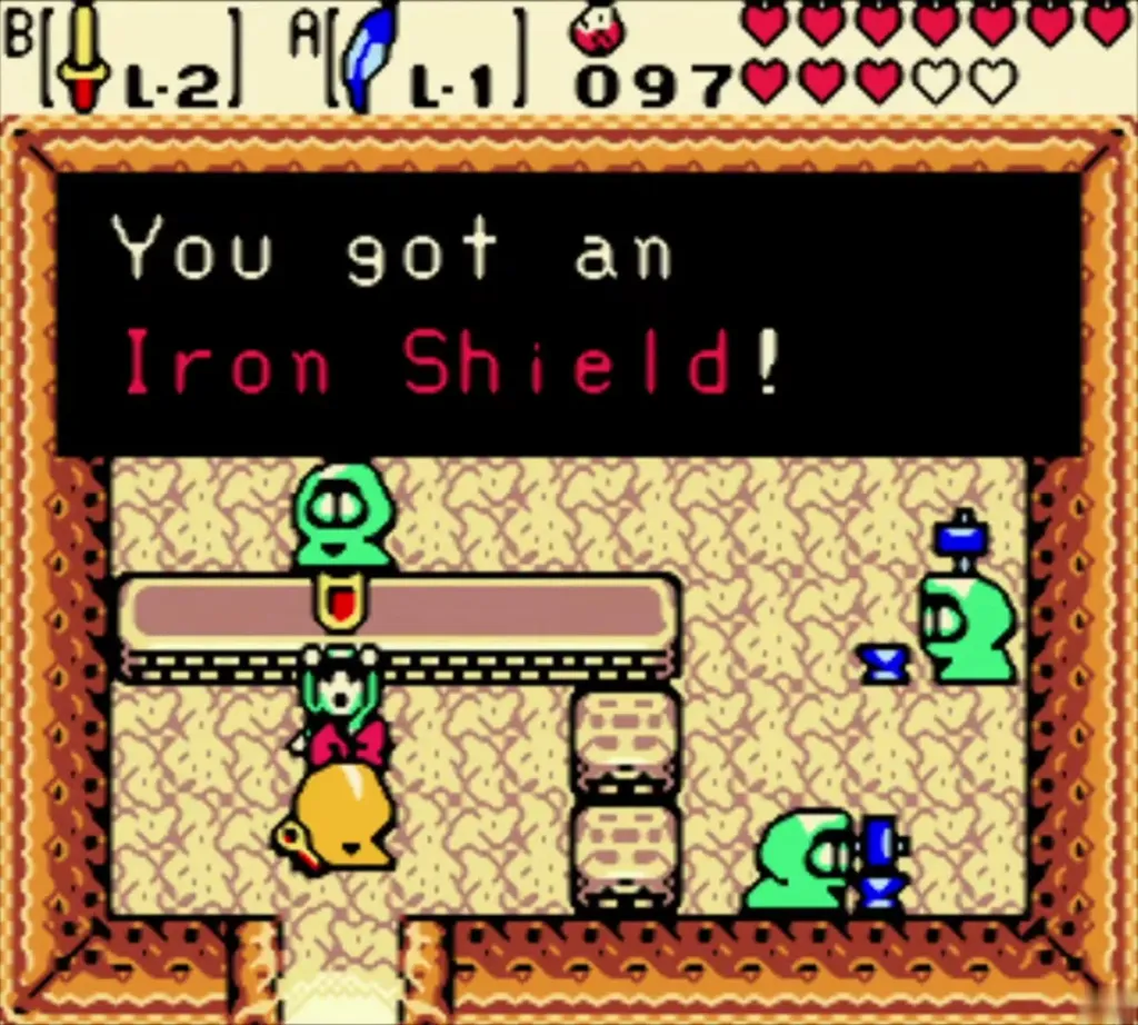 Subrosian Smithy with Link and the item-get message reading "You got an Iron Shield!" in the box Subrosian Smithy with Link and the item-get message reading "You got an Iron Shield!" in the box