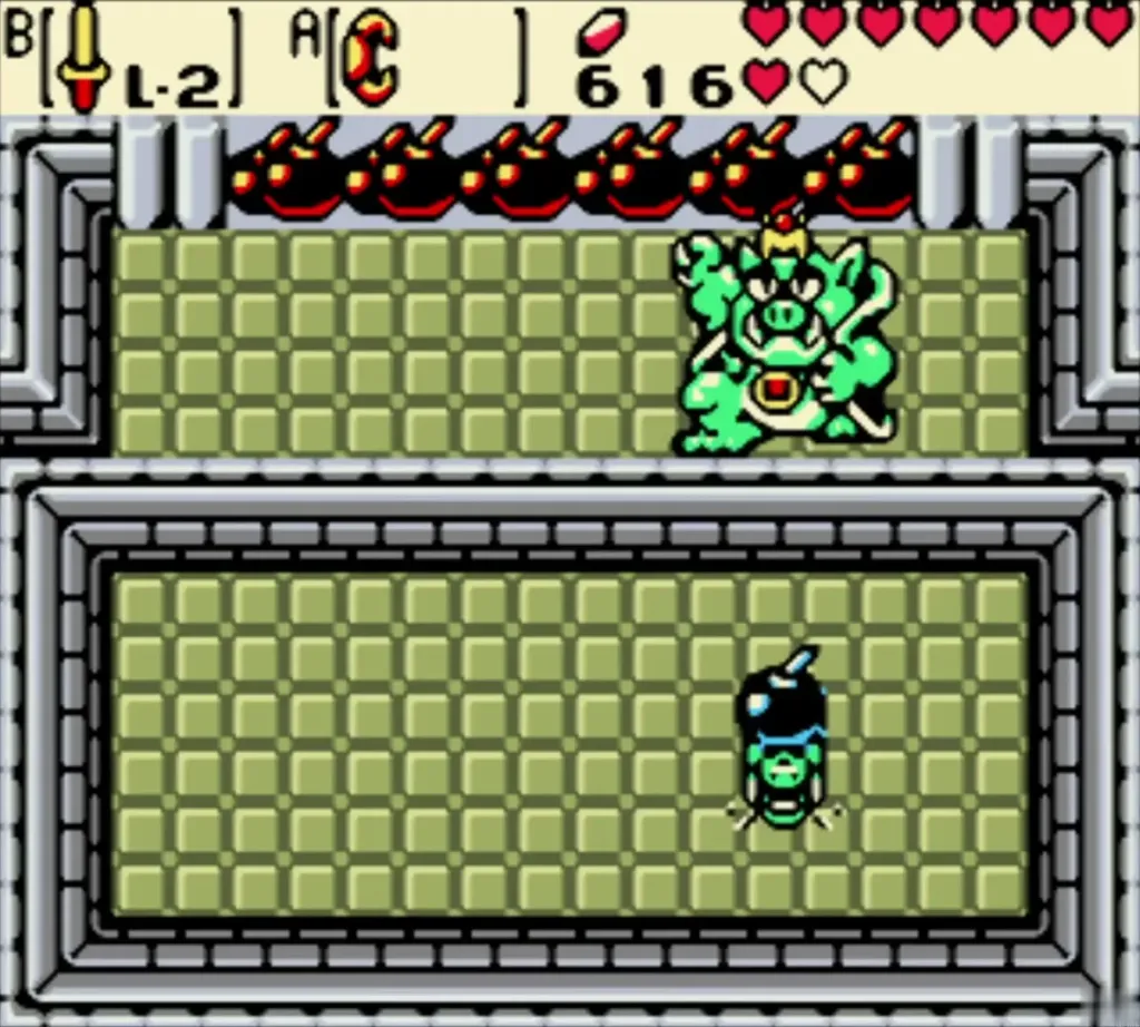 Link in the grey arena with the Great Moblin at the top right and bombs in play Link in the grey arena with the Great Moblin at the top right and bombs in play