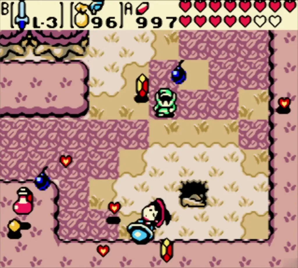Maple among rupees, a bomb and hearts scattered across the pink cave floor Maple among rupees, a bomb and hearts scattered across the pink cave floor
