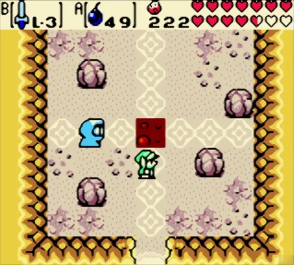 Link standing beside the red target block in the cave near the lava Link standing beside the red target block in the cave near the lava
