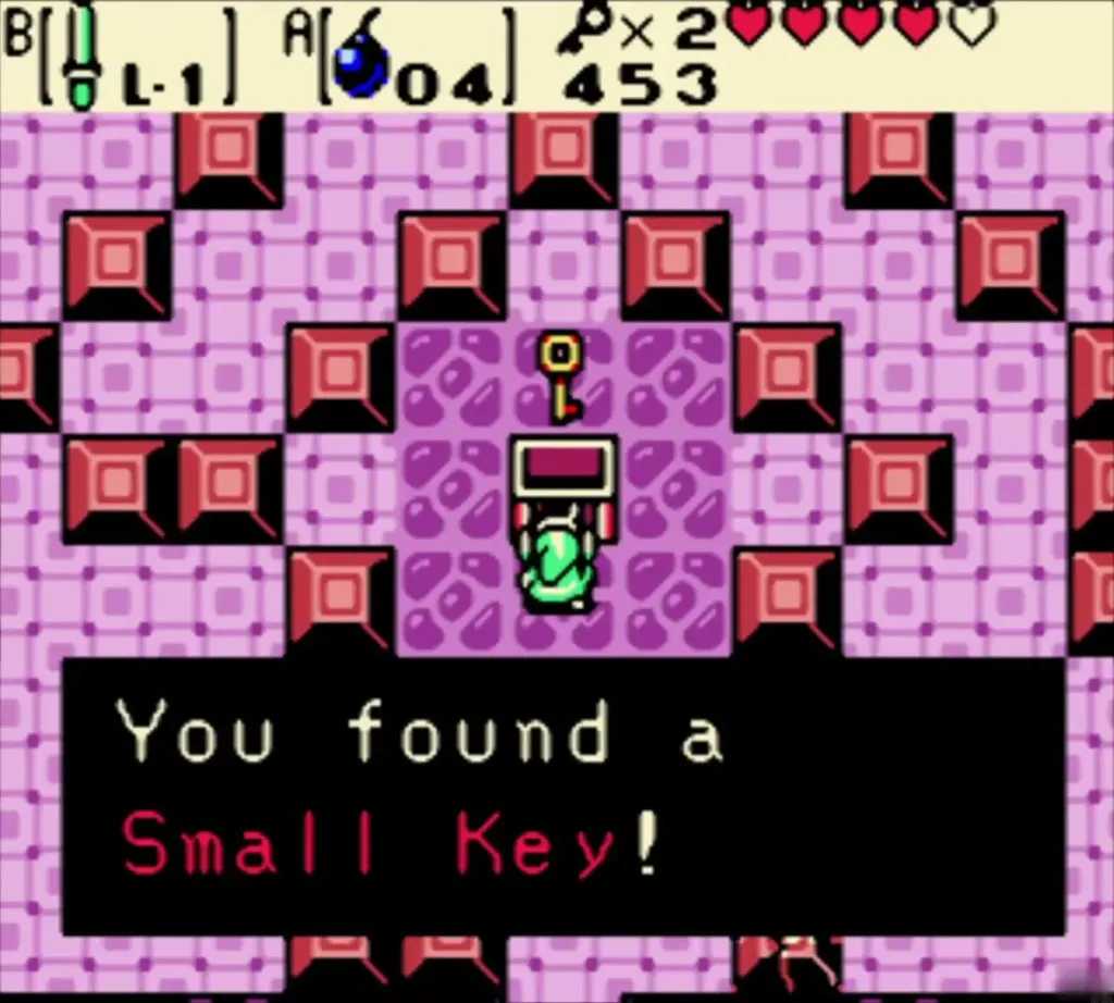 Link holding up the Small Key with the You found a Small Key message Link holding up the Small Key with the You found a Small Key message