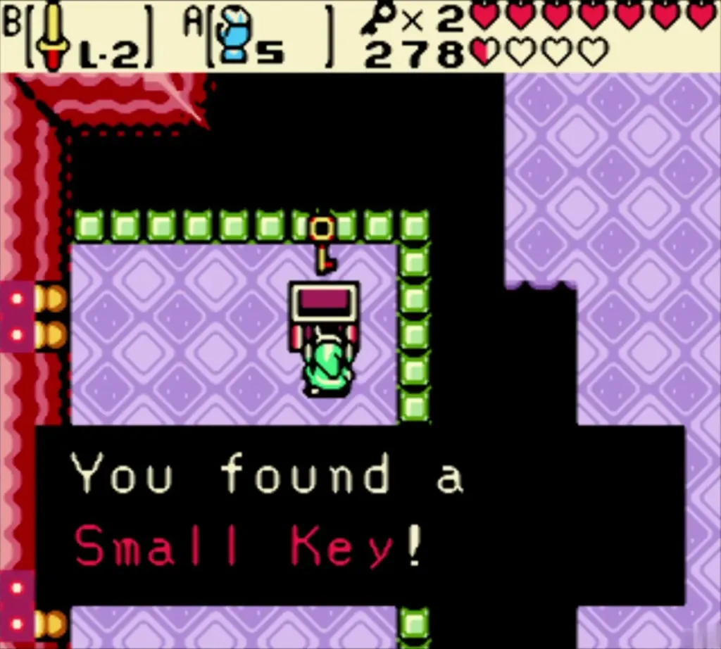 Small Key message box over Link in a purple room, with the key floating above him