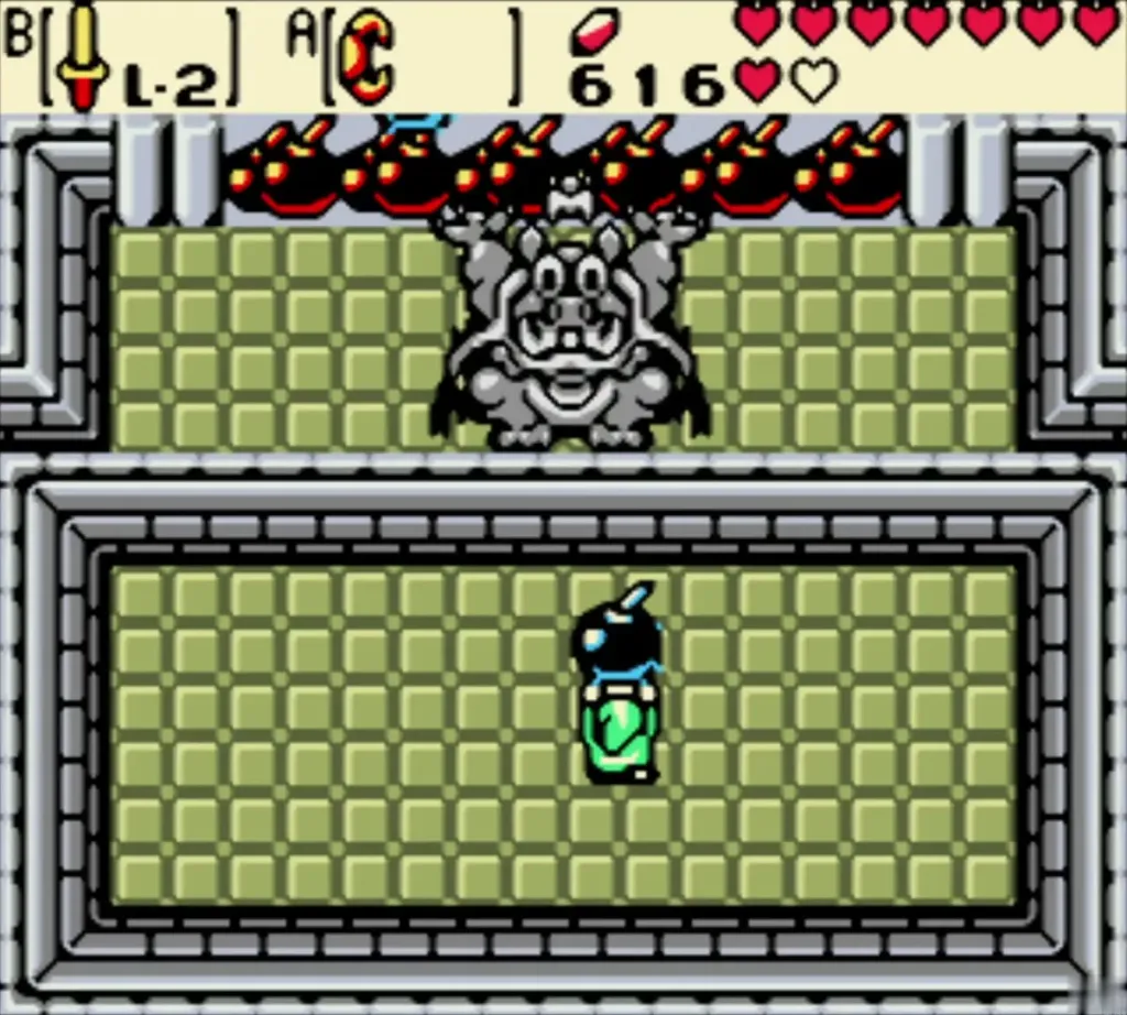 Link holding a bomb to time his throw at the grey Great Moblin Link holding a bomb to time his throw at the grey Great Moblin