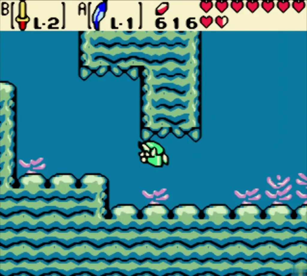 Link swimming underwater between green rock walls Link swimming underwater between green rock walls