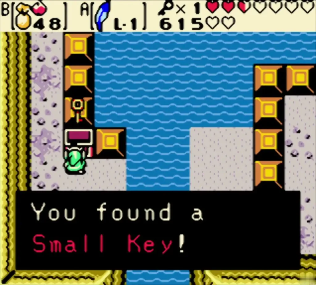 Link holding up a Small Key with the You found a Small Key message complete Link holding up a Small Key with the You found a Small Key message complete