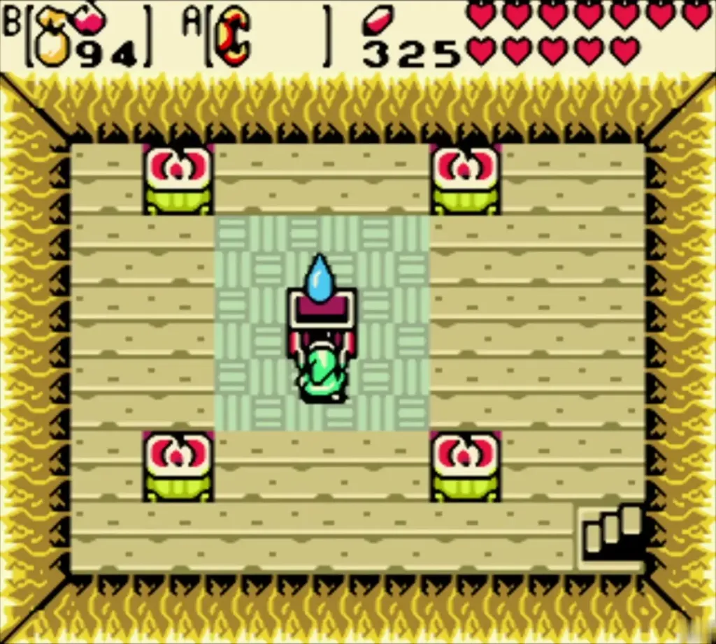 Link standing at the chest in the middle of the sand cave room