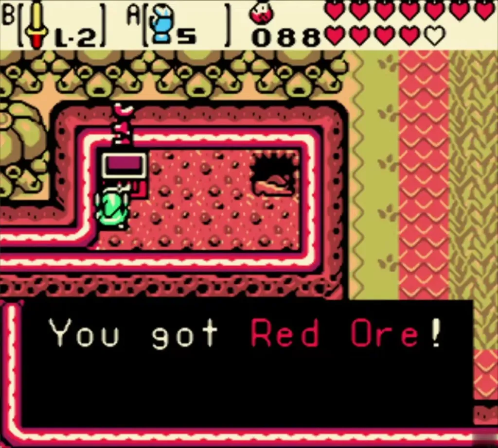 Subrosia red-walled room with the You got Red Ore message fully shown