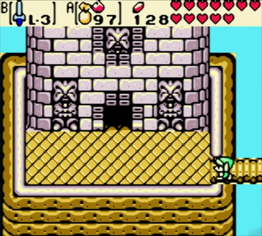 Link at the edge of the ledge by the stone temple entrance with its guardian statues