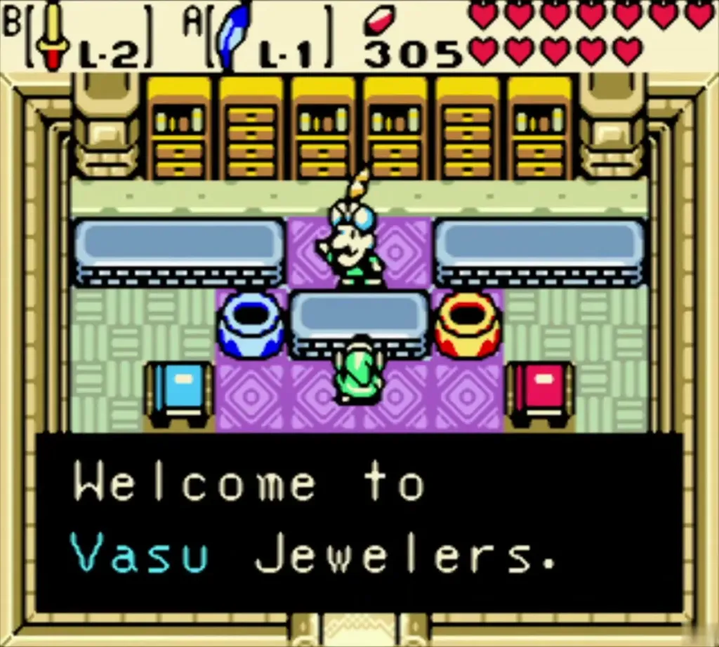 Vasu behind the jewelers counter, with the Welcome to Vasu Jewelers message fully shown