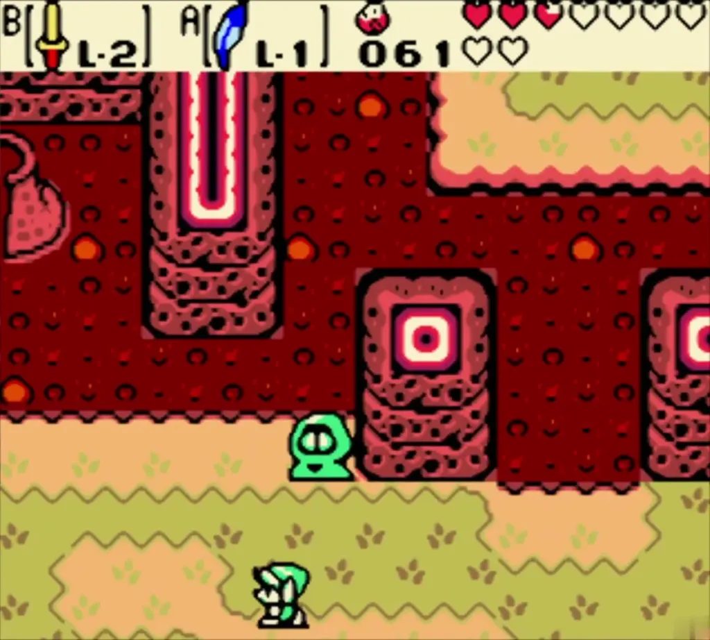 Link walking the lava path west past a green Subrosian beside lava pillars Link walking the lava path west past a green Subrosian beside lava pillars