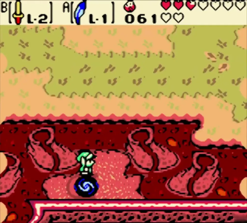 Link stepping onto the swirling portal on the red ledge Link stepping onto the swirling portal on the red ledge