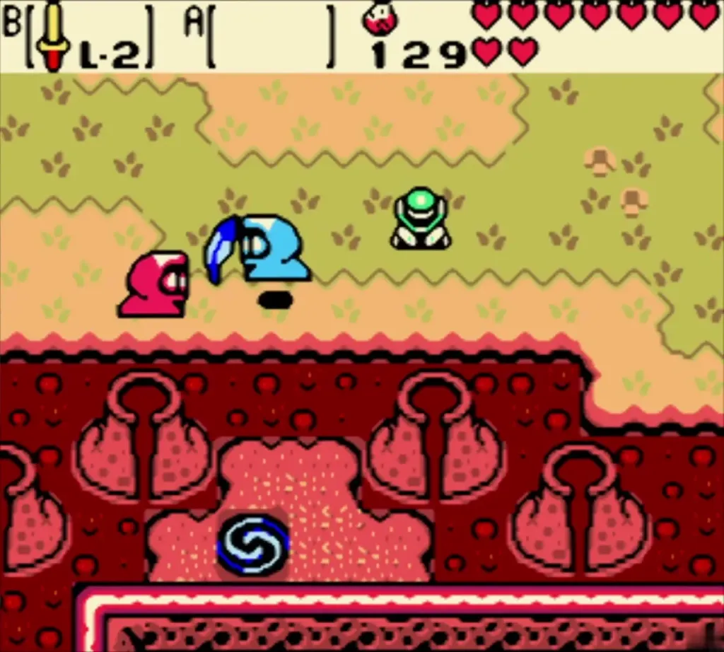 A red and a blue Subrosian run off with Link's Roc's Feather A red and a blue Subrosian run off with Link's Roc's Feather