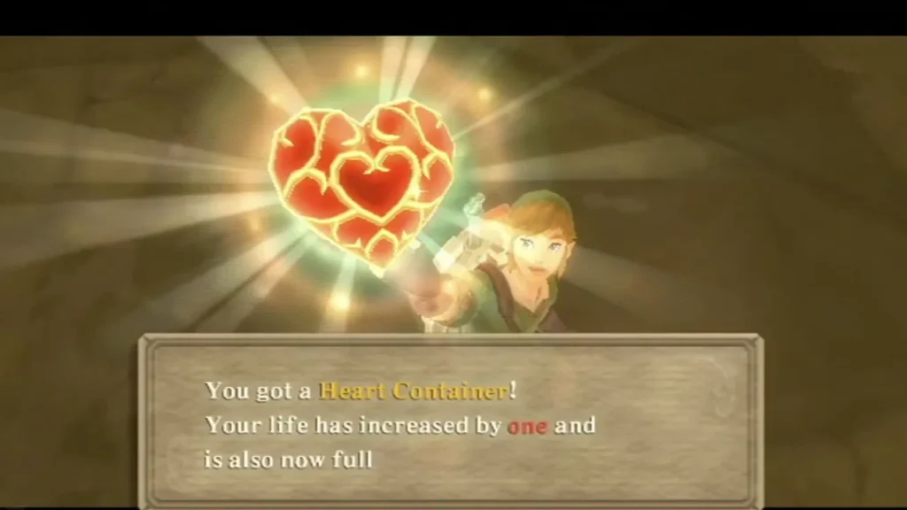 Link holds up a glowing red Heart Container, and the box says his life has increased by one and is now full Link holds up a glowing red Heart Container, and the box says his life has increased by one and is now full