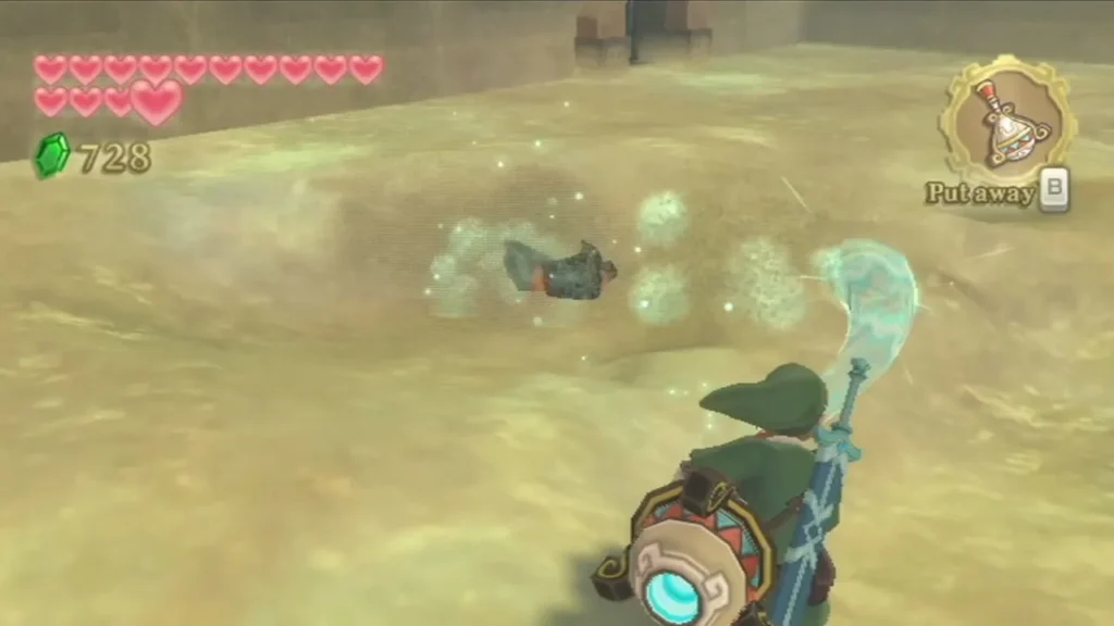 Link blows the sand with the Gust Bellows, a cyan gust scattering dust across the arena floor Link blows the sand with the Gust Bellows, a cyan gust scattering dust across the arena floor