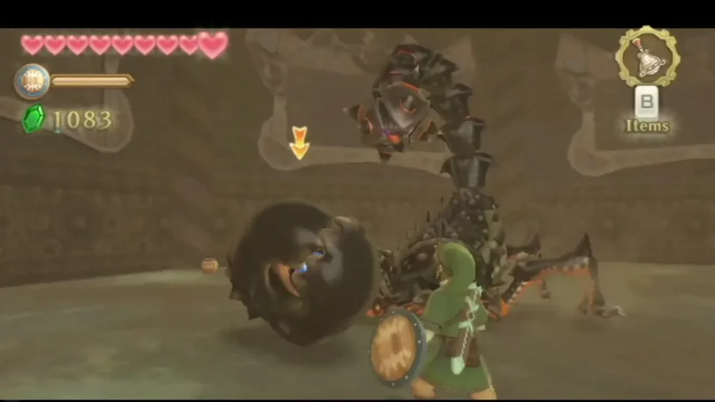 Link slashes at one of Moldarach's black claws, which has an eye inside, in the sand arena. Link slashes at one of Moldarach's black claws, which has an eye inside, in the sand arena.